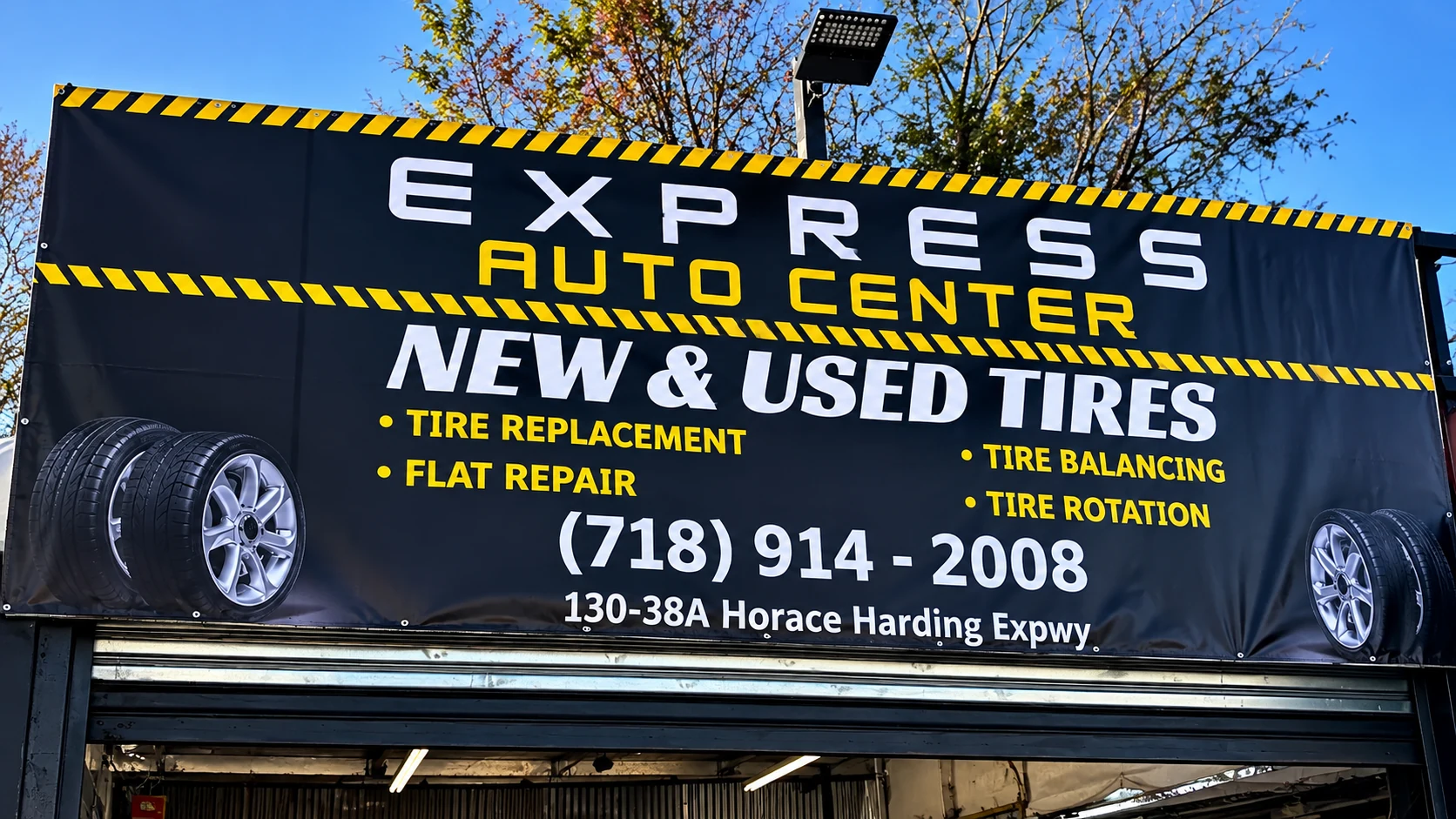 Express Auto Center sign above the storefront and garage in Flushing